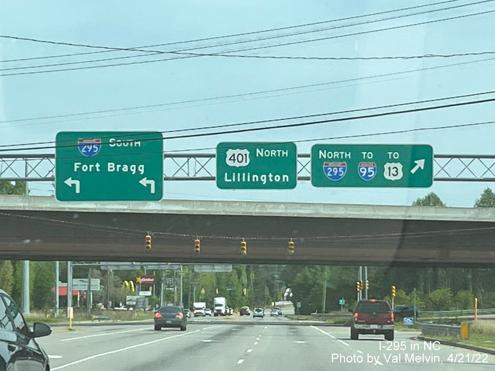 Image of new I-295 shields on overhead signs on US 401 North near 
       Spring Lake, photo by Val Melvin, April 2022