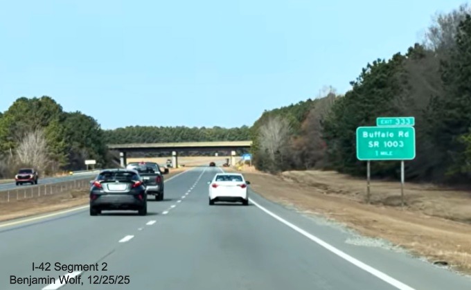 Image of 1 Mile advance sign for the Buffalo Road exit in Selma, screen grab from 
	Benjamin Wolf video, December 2025