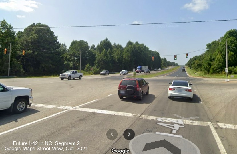 Image of current intersection between US 70 and Swift Creek Road showing little construction as of yet, 
        Google Maps Street View, August 2021