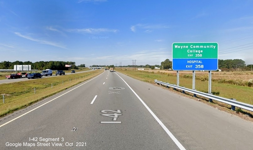 Image of combination auxiliary and services sign for Wayne Memorial Drive exit on US 70 Bypass West around Goldsboro, Google Maps Street View image, October 2021