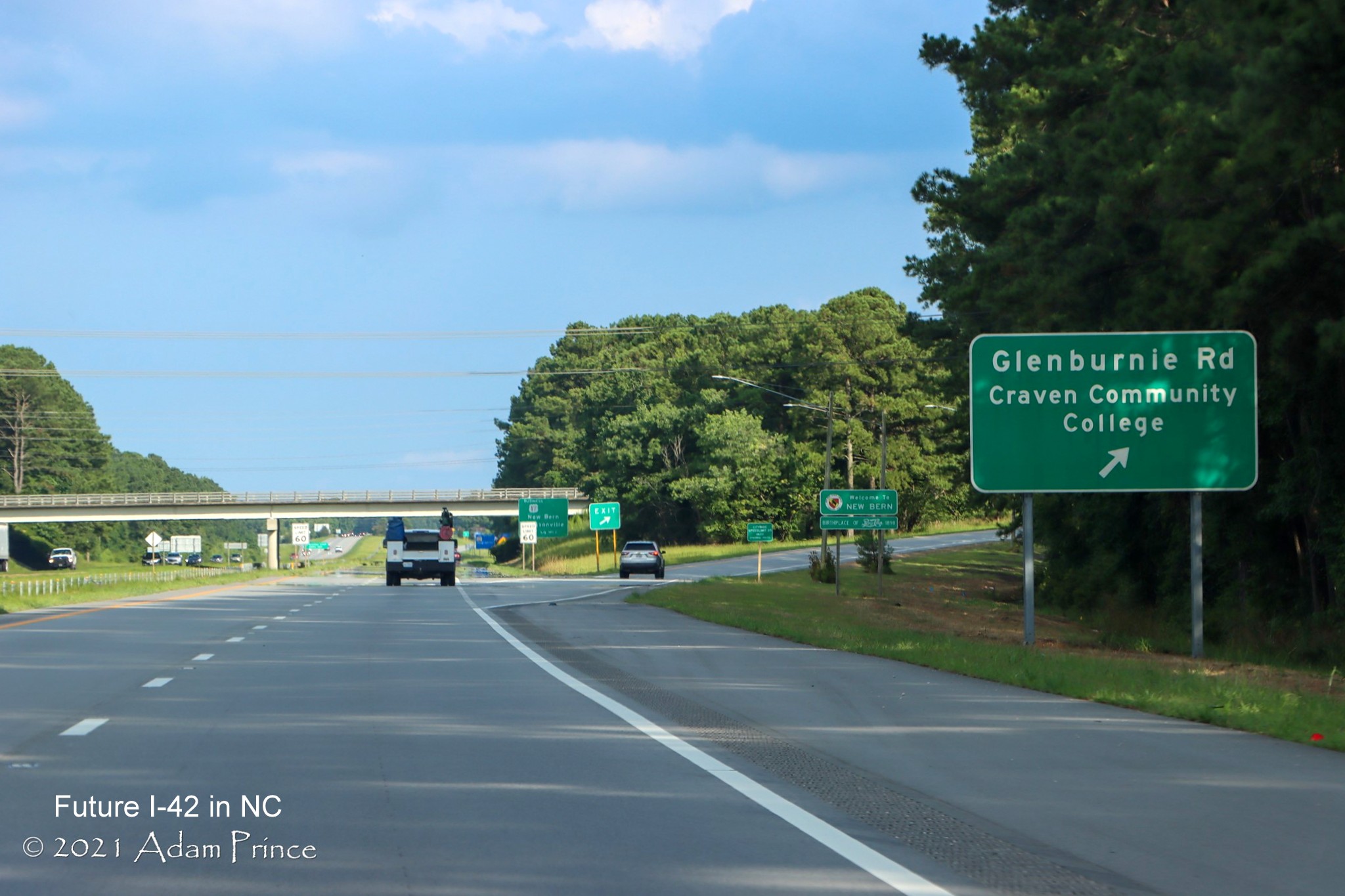 Image of Craven Community College exit sign along newly widened right shoulder of US 70 (Future I-42) East in Craven County, photo by Adam Prince, July 2021