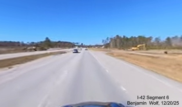 Image of construction along US 70 West at the future Stately Pine Road exit,
		screen grab from Benjamin Wolf video, December 2025