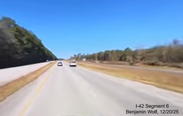 Image of construction along US 70 West at the future Fisher Avenue exit,
		screen grab from Benjamin Wolf video, December 2025
