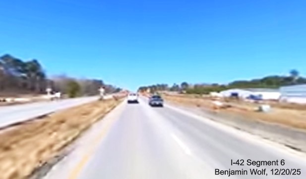 Image of construction along US 70 West after the future Thurman Road exit,
		screen grab from Benjamin Wolf video, December 2025