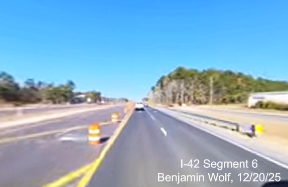 Image of US 70 West traffic being shifted to frontage road approaching the 
		future Taberna Way exit, screen grab from Benjamin Wolf video, December 2025