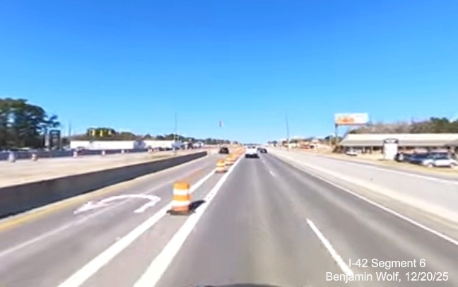 Image of temporary traffic turnaround on US 70 West for traffic from
		Grantham Road, screen grab from Benjamin Wolf video, December 2025