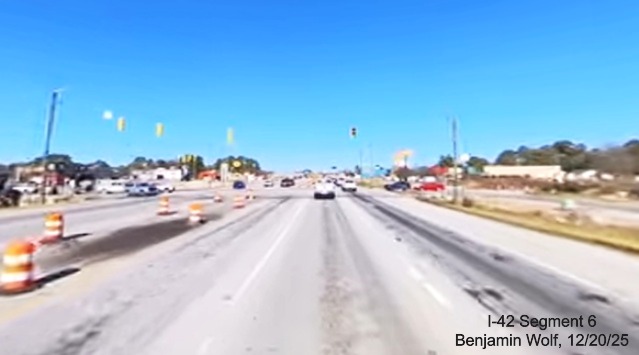 Image of traffic approaching the future Williams Road exit on US 70 (Future) I-42 
		West, screen grab from Benjamin Wolf video, December 2025