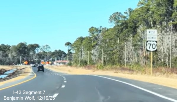 Image of new West Business US 70 reassurance marker after taking exit from
	US 70 (Future I-42) West at the start of the Havelock Bypass, Screen grab from Benjamin Wolf video, December 2025