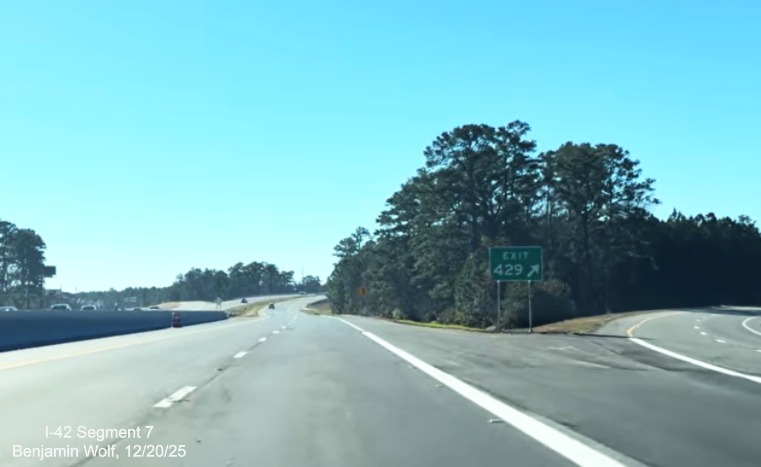 Image of gore sign for Business US 70 East exit at the west end of the US 
	70 (Future I-42) East Havelock Bypass, Screen grab from Benjamin Wolf video, December 2025