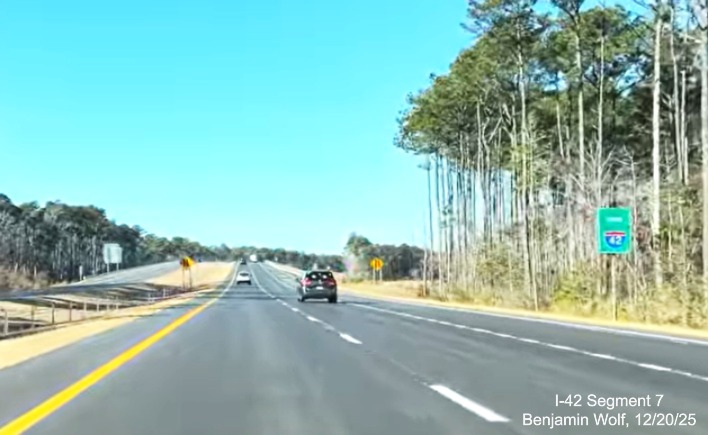 Image of first Future I-42 sign on West US 70, prior in this direction to the 
	West US 70 reassurance marker on the (Future I-42) West Havelock Bypass, Screen grab from Benjamin Wolf video, December 2025