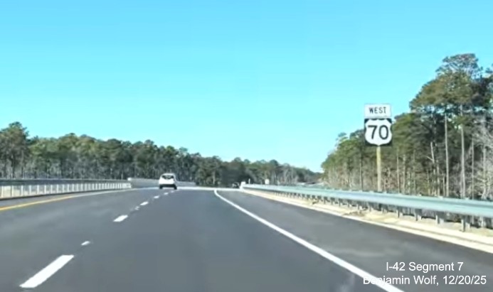 Image of first West US 70 reassurance marker after the start of the US 70 (Future 
	I-42) West Havelock Bypass, Screen grab from Benjamin Wolf video, December 2025