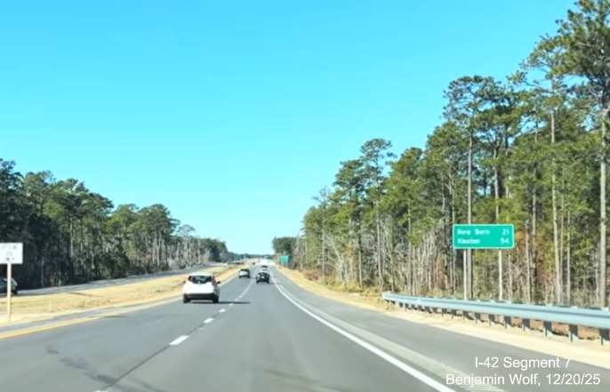 Image of post-interchange distance sign for New Bern and Kinston at the 
	start of the US 70 (Future I-42) West Havelock Bypass, Screen grab from Benjamin Wolf video, December 2025