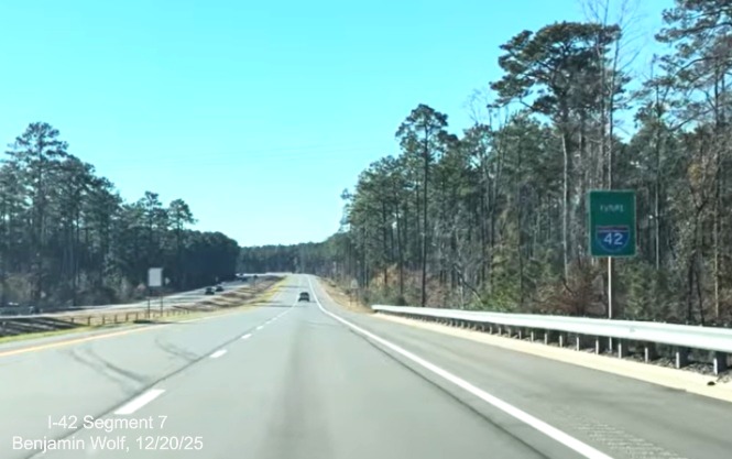 Image of Future I-42 sign along the US 70 East Havelock Bypass, Screen grab from 
	Benjamin Wolf video, December 2025
