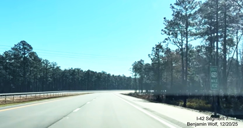 Image of Mile Marker 432 sign on the US 70 (Future I-42) East Havelock Bypass, 
	Screen grab from Benjamin Wolf video, December 2025
