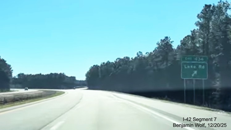 Image of ground mounted ramp sign for the Lake Road exit on the US 
	70 (Future I-42) East Havelock Bypass, Screen grab from Benjamin Wolf video, December 2025