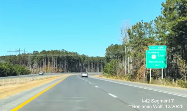 Image of US 70 West mile marker prior to exit for East Business 70 on US 70 (Future 
	I-42) West Havelock Bypass, Screen grab from Benjamin Wolf video, December 2025