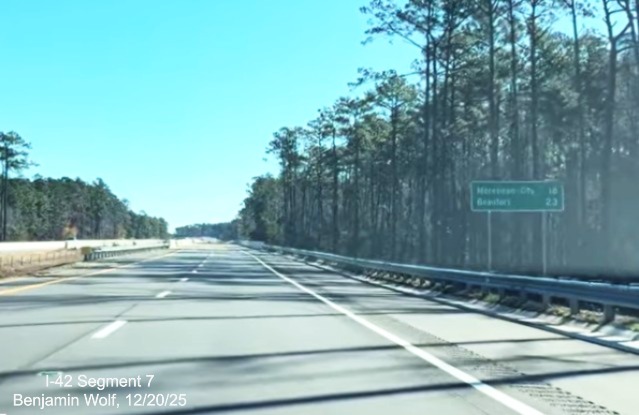 Image of post-interchange distance sign after the Lake Road exit on the US 
	70 (Future I-42) East Havelock Bypass, Screen grab from Benjamin Wolf video, December 2025