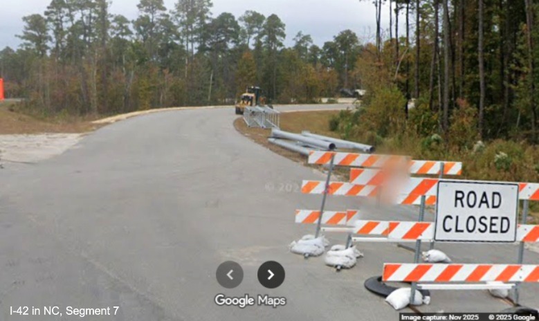 Image of sign supports being stored along the future ramp to the Havelock Bypass
	heading west, Google Maps Street View, November 2025