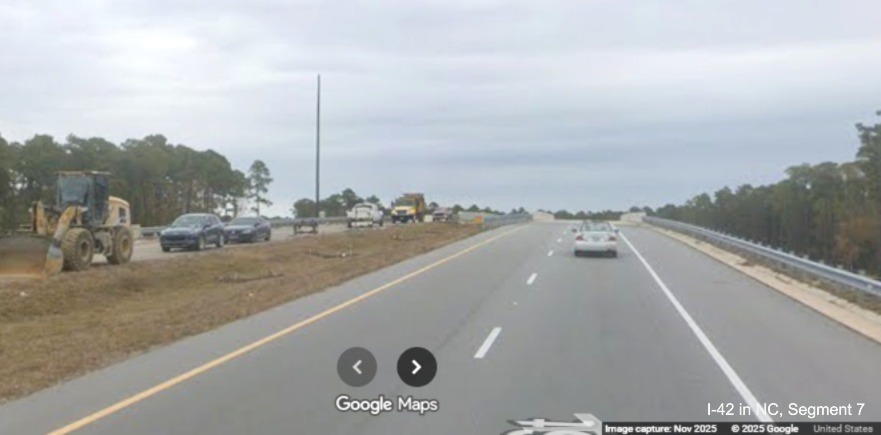 Image of US 70 East approaching bridge over the future Havelock Bypass with westbound
	road still under construction, Google Maps Street View, November 2025