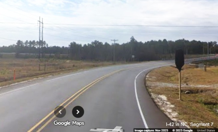 Image of covered over Jct US 70 Bypass sign approaching the future Lake Road exit
	with the Havelock Bypass, Google Maps Street View, November 2025