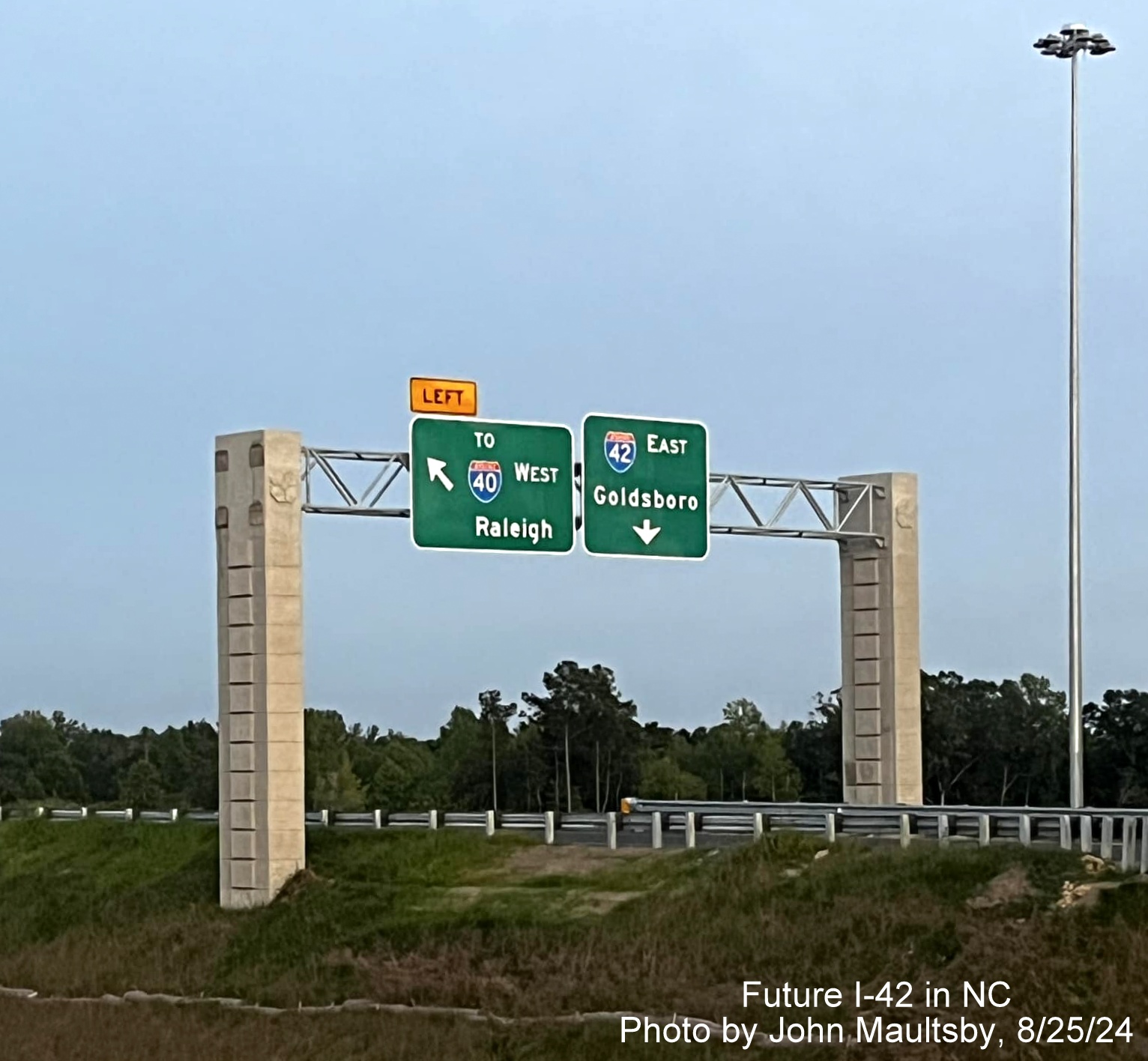 Image of new I-42 shield on overhead ramp sign along currently unopened section of NC 540 Turbine interchange, by John Maultsby, August 2024