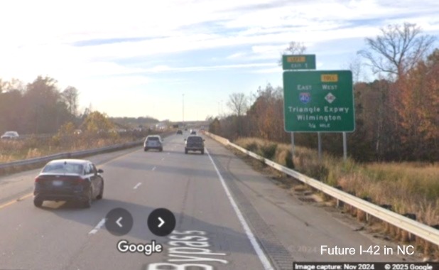 Image of newly placed 1/2 advance sign for I-40/NC 540 exit on US 70 West, 
		Google Maps Street View, November 2024