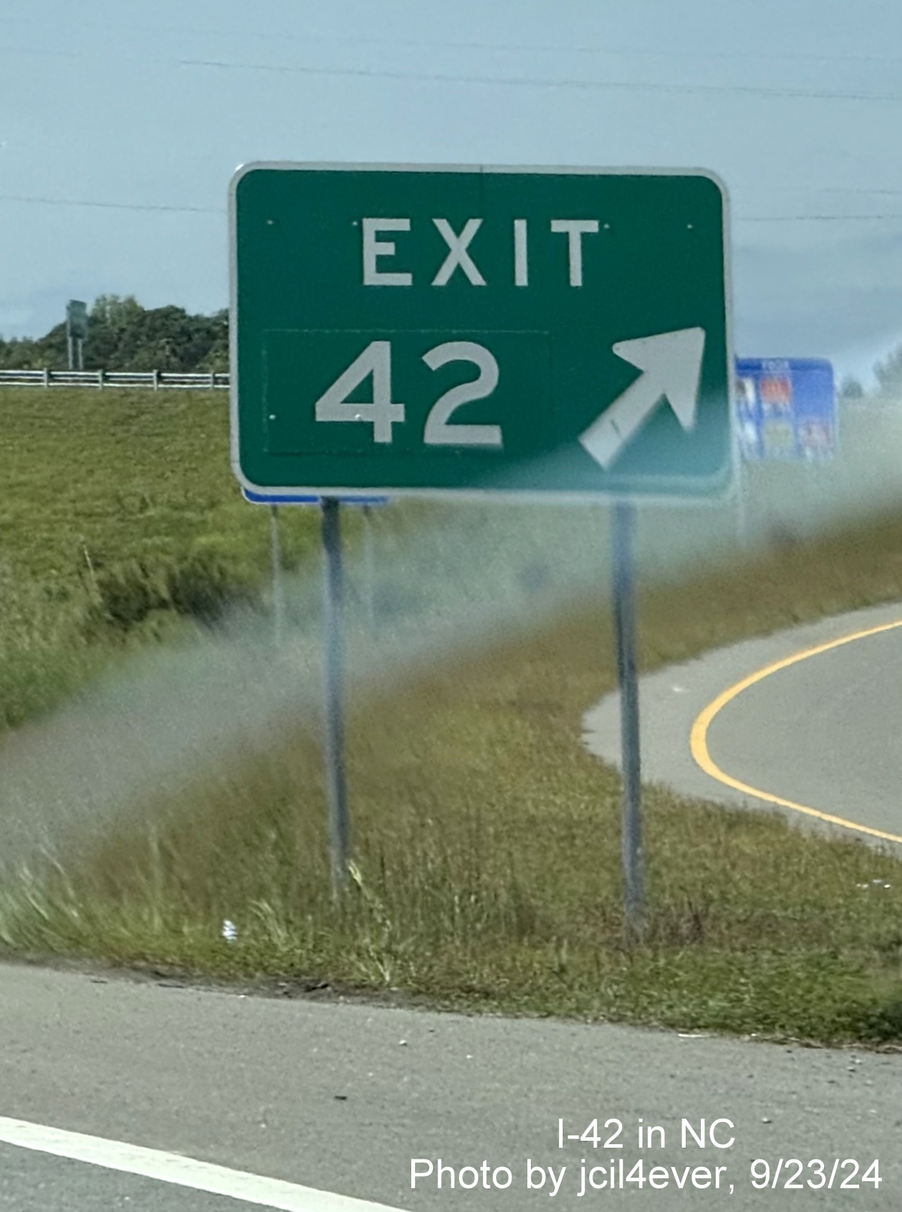 Image of renumbered gore sign with I-42 mileposts for Wayne Memorial Drive exit on Goldsboro 
      Bypass, by jcil4ever, Sept. 2024