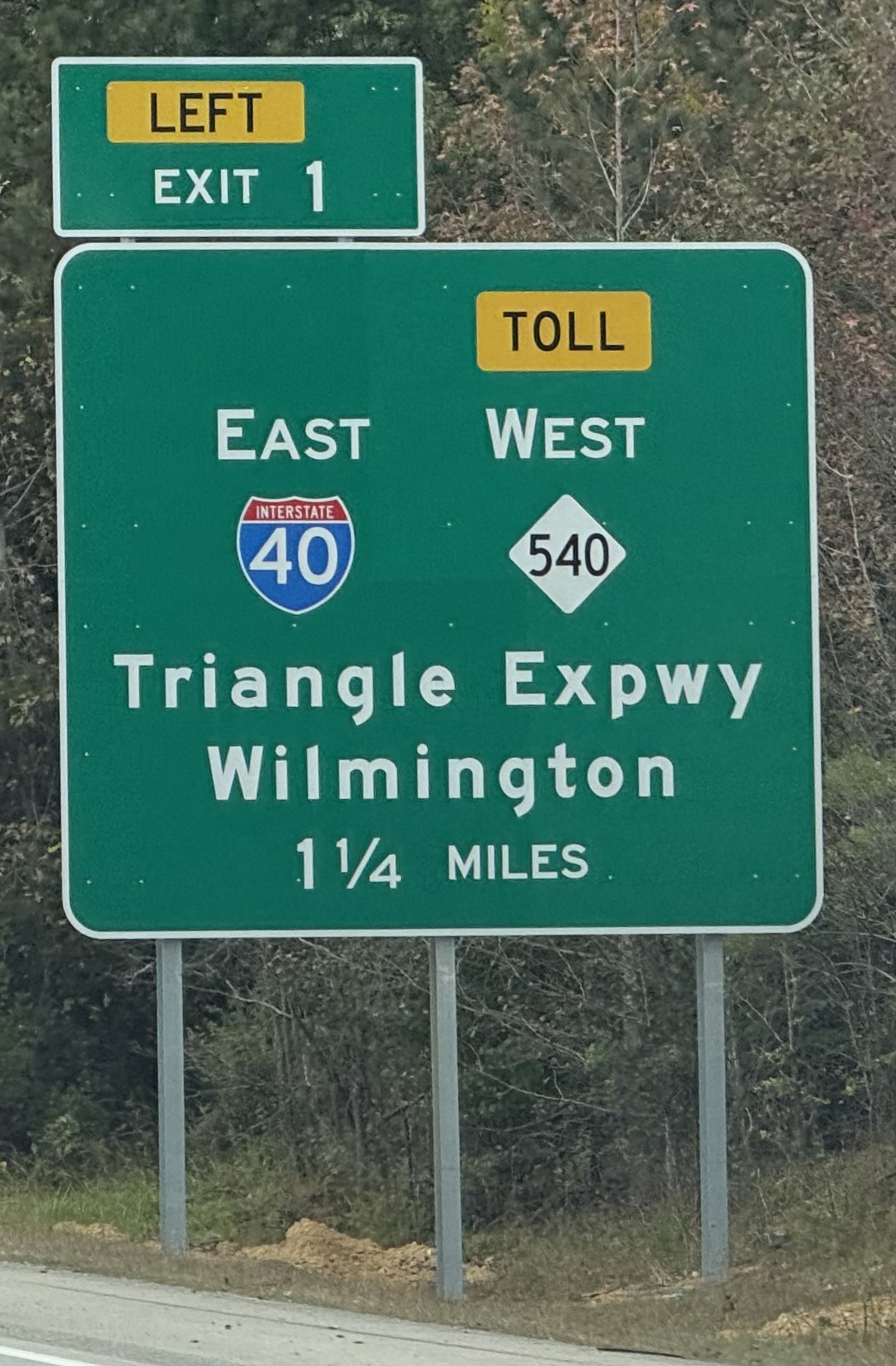 Image of newly placed 1 1/4 Miles advance sign for I-40 East/NC 540 West exit at end of Future I-42 West/Clayton Bypass with I-42 milepost exit number, by Benjamin Wolf, November 2024