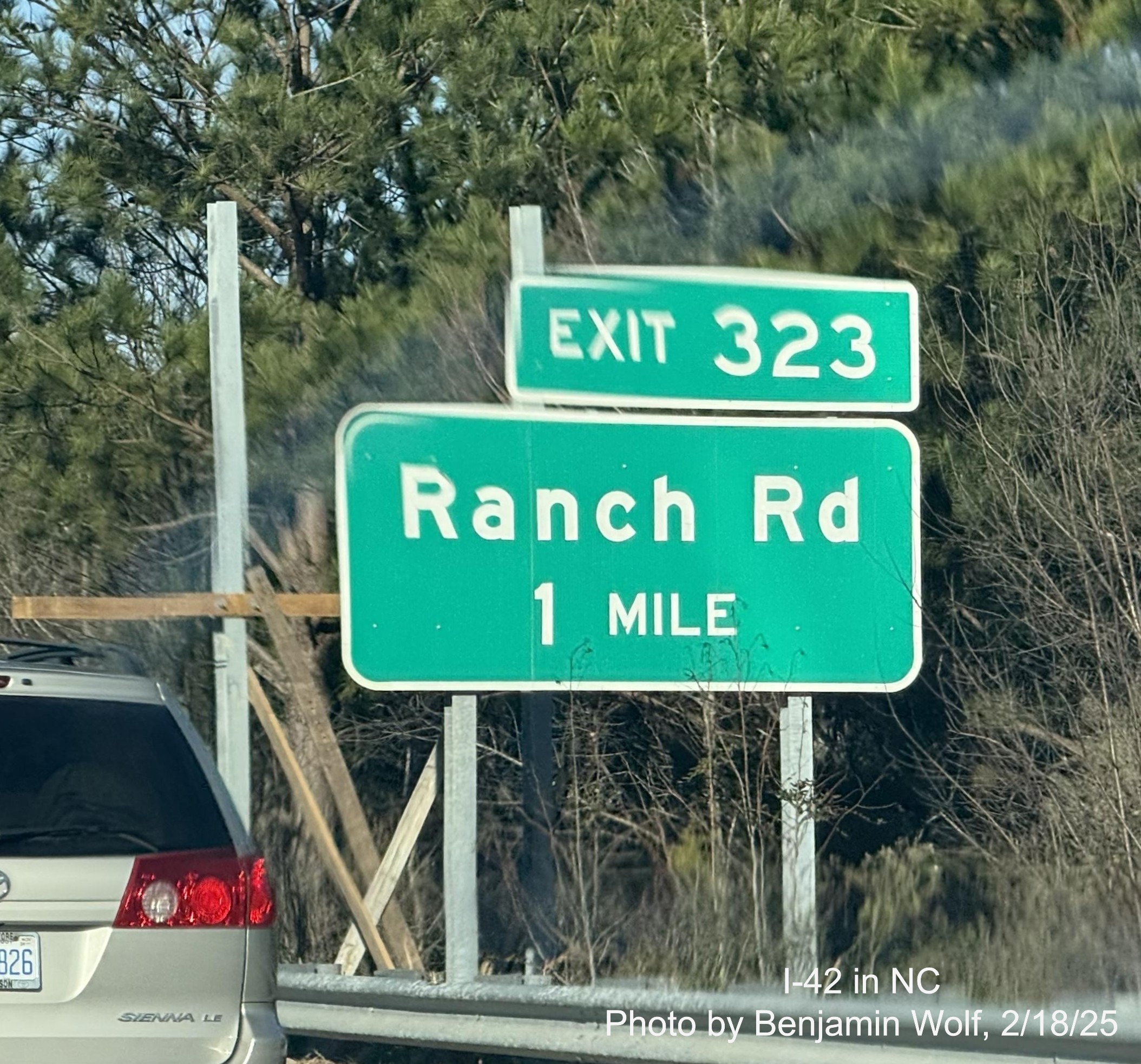 Image of supports for future NC 36 exit sign and existing Ranch Road sign on
	  the Clayton Bypass, by Benjamin Wolf, February 2025