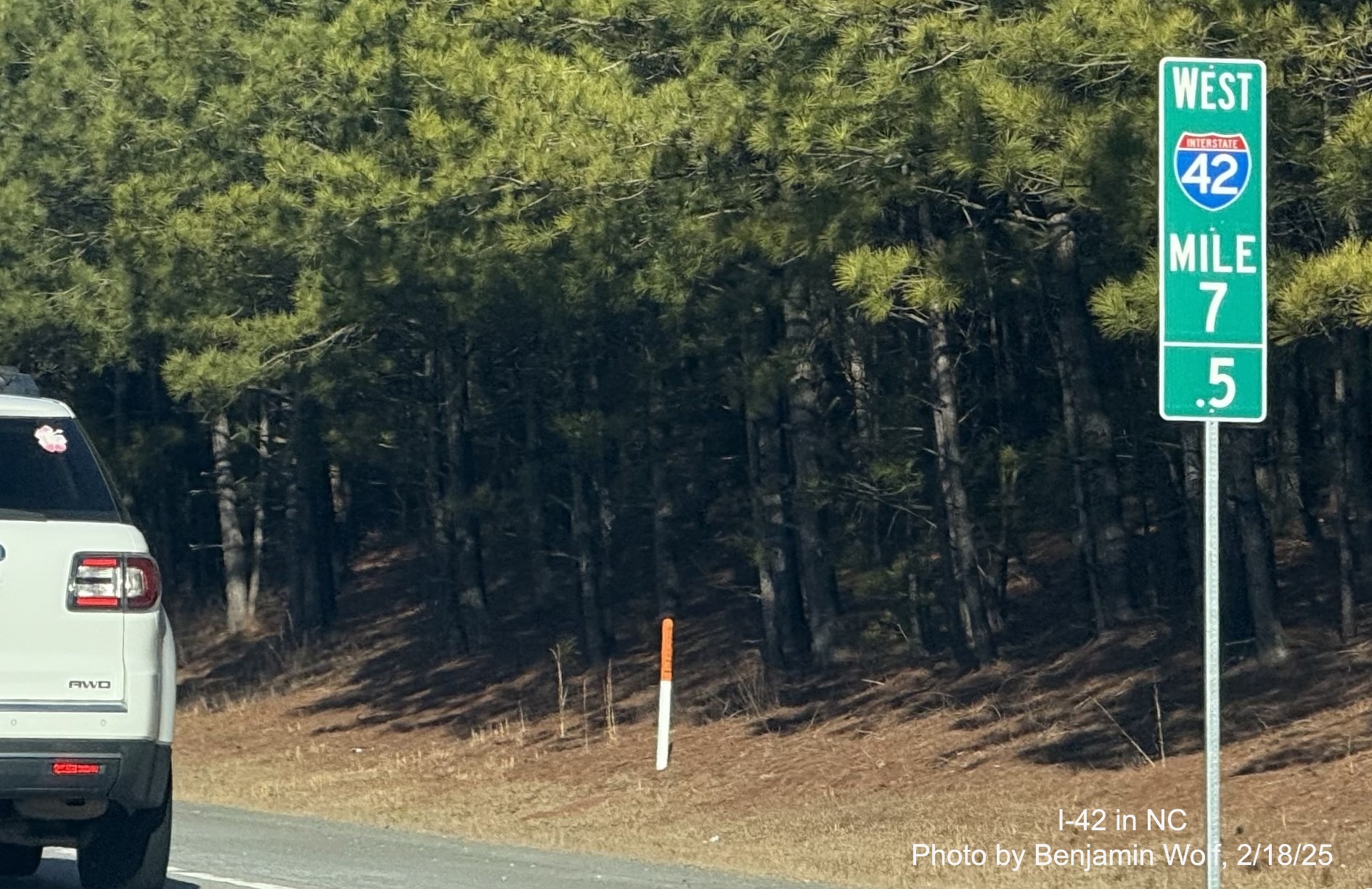 Image of new West I-42 Mile 7.5 marker prior to the current Ranch Road exit on
	  the Clayton Bypass, by Benjamin Wolf, February 2025