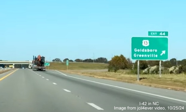 Image of renumbered exit sign for US 13 exit on I-42 West/Goldsboro Bypass, from jcil4ever video, 
      October 2024