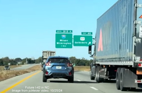 Image of renumbered exit sign for US 117 exit on I-42 West/Goldsboro Bypass, from jcil4ever video, 
      October 2024