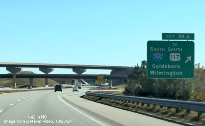 Image of renumbered exit sign for I-795 South exit on I-42 East/Goldsboro Bypass, from jcil4ever video, 
      October 2024