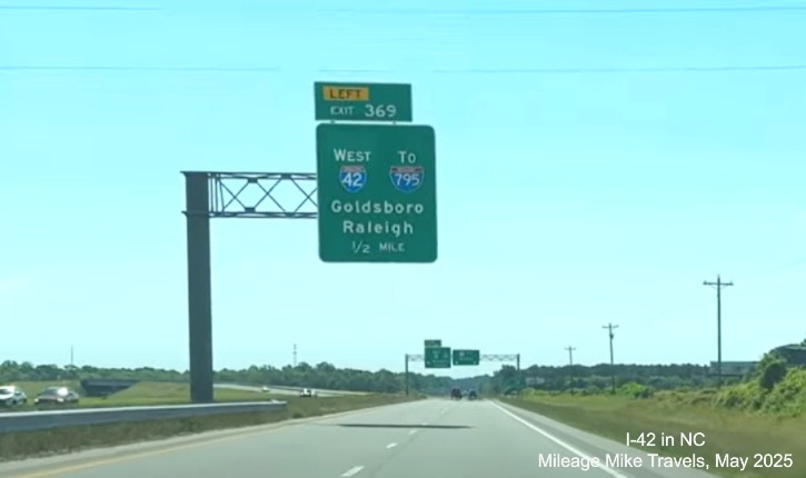 Image of 1/2 Mile advance overhead sign for I-42 West exit on US 70 West at
end of Goldsboro Bypass, screen grab from Mileage Mike video, May 2025