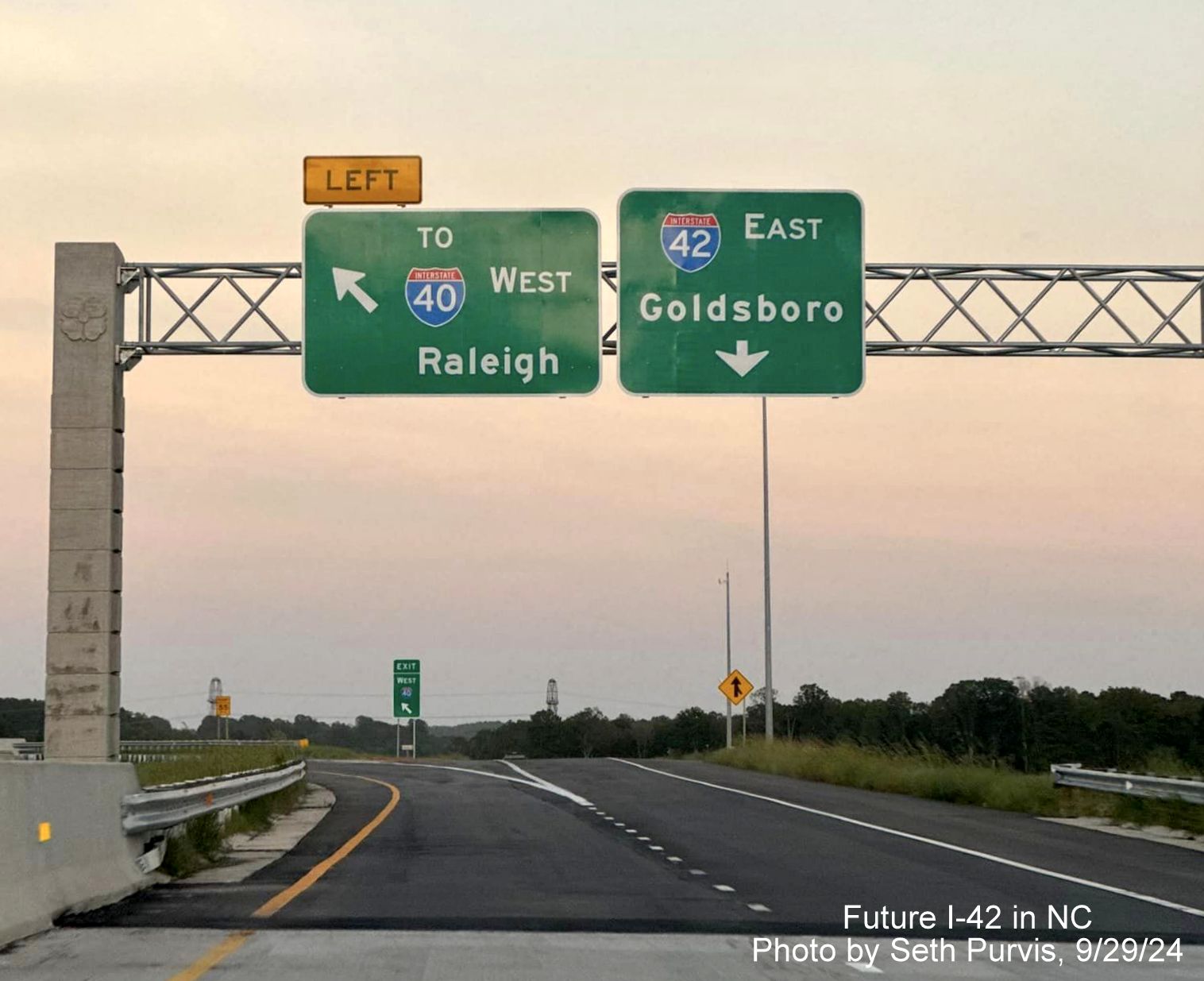 Image of overhead ramp sign for I-40 and I-42 at split of ramp from end of NC 540/Triangle Expressway at 
        the Turbine Interchange, by Seth Purvis, September 2024