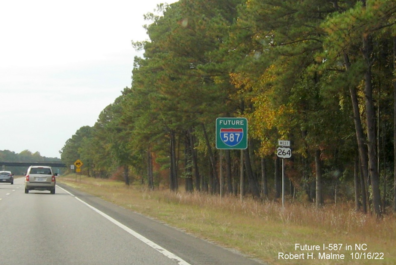 Image of Future I-587 sign besides West US 264 reassurance marker in Sims, October 2022