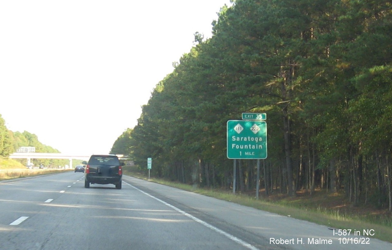 Image of 1 mile advance sign for NC 111/222 exit with new I-587 milepost exit number on I-587 East in Saratoga, October 2022