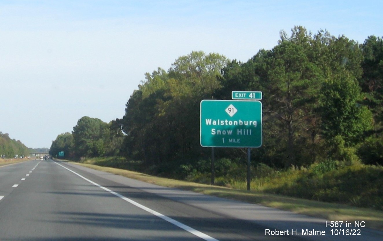 Image of 1 mile advance sign for NC 91 exit with new I-587 milepost exit number on I-587 East in Snow Hill, October 2022