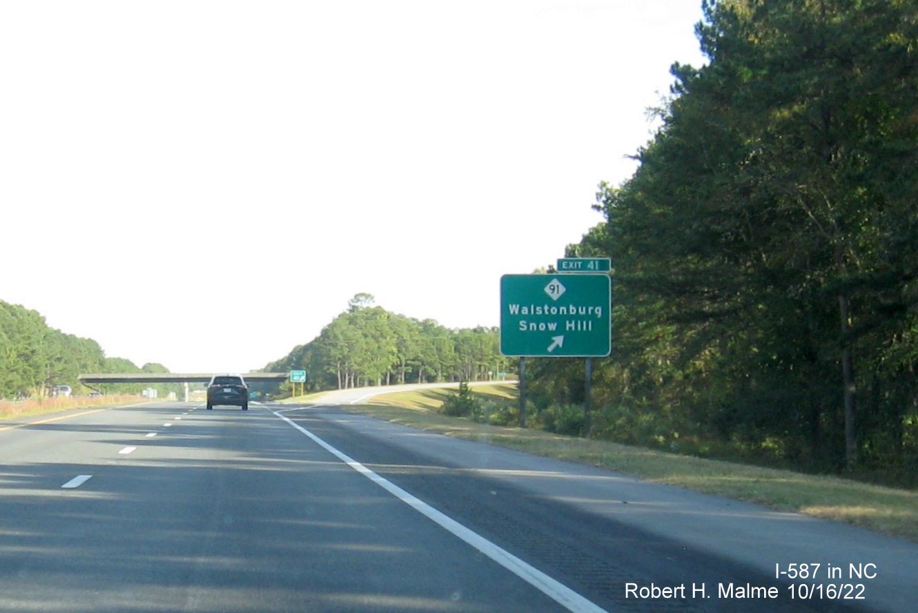 Image of ground mounted sign for NC 91 exit with new I-587 milepost exit number on I-587 East in Snow Hill , October 2022