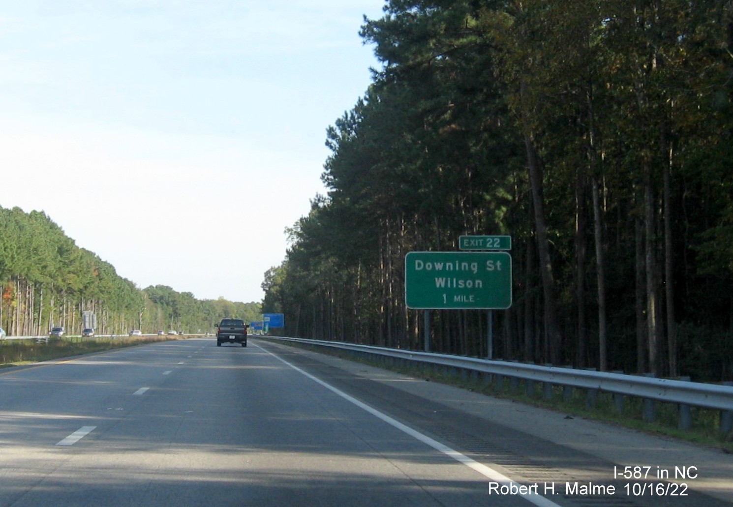 Image of 1 mile advance sign for Downing Street exit with new I-587 milepost exit number on I-587/US 264 East,I-795 
                                        South in Wilson, October 2022