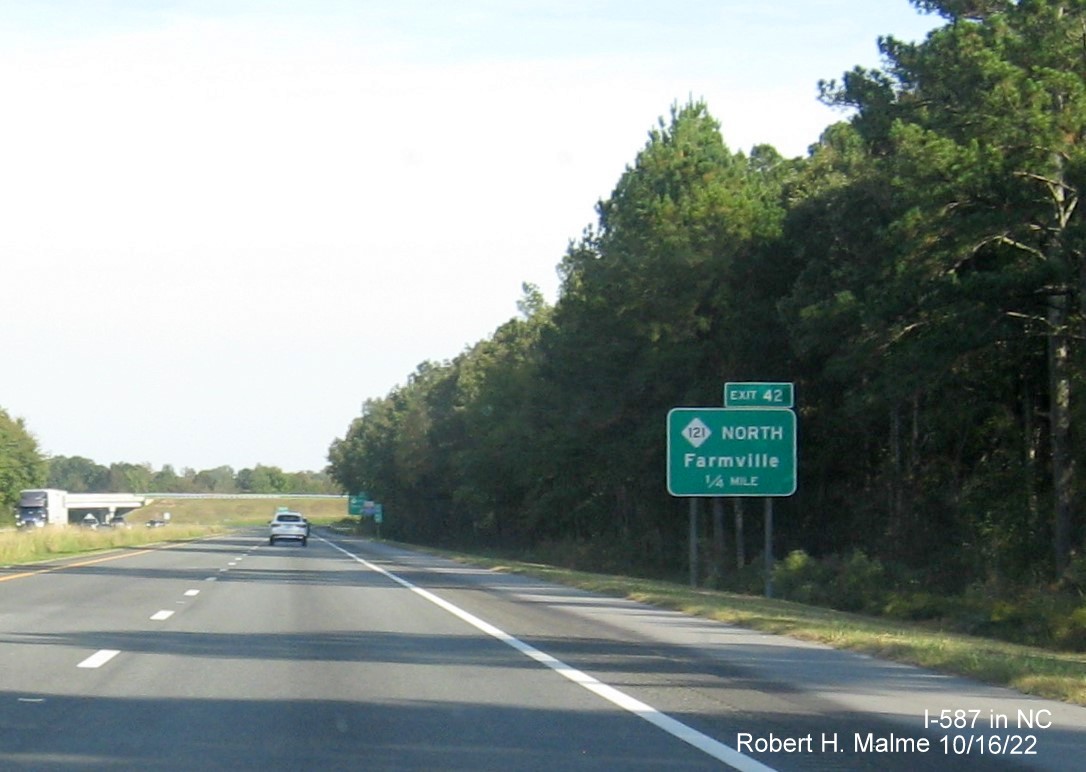 Image of 1 mile advance sign for NC 111/222 exit with new I-587 milepost exit number on I-587 East in Farmville, October 2022