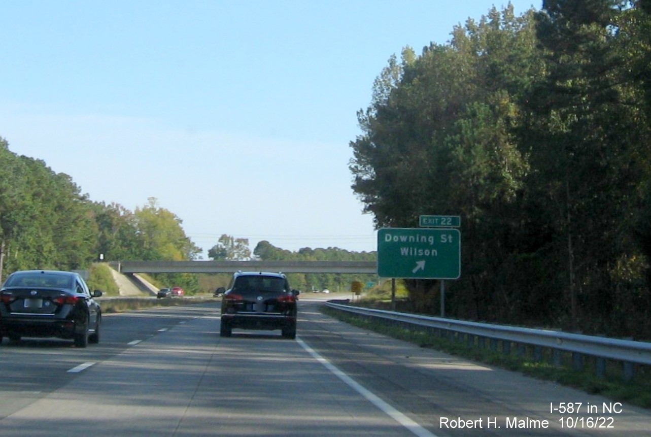 Image of exit sign for Downing Street exit with new I-587 milepost exit number on I-587/US 264 East,I-795 
                                        South in Wilson, October 2022
