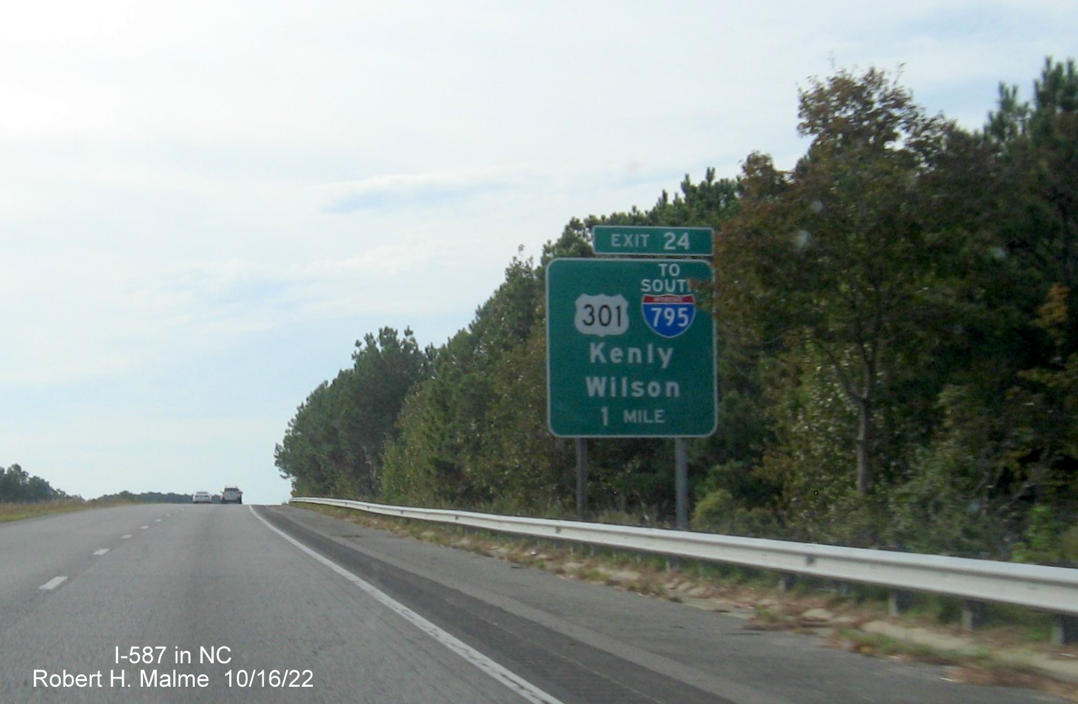 Image of 1 mile advance sign for US 301 to I-795 South exit with new I-587 milepost exit number on I-587/US 264 West in Wilson, October 2022
