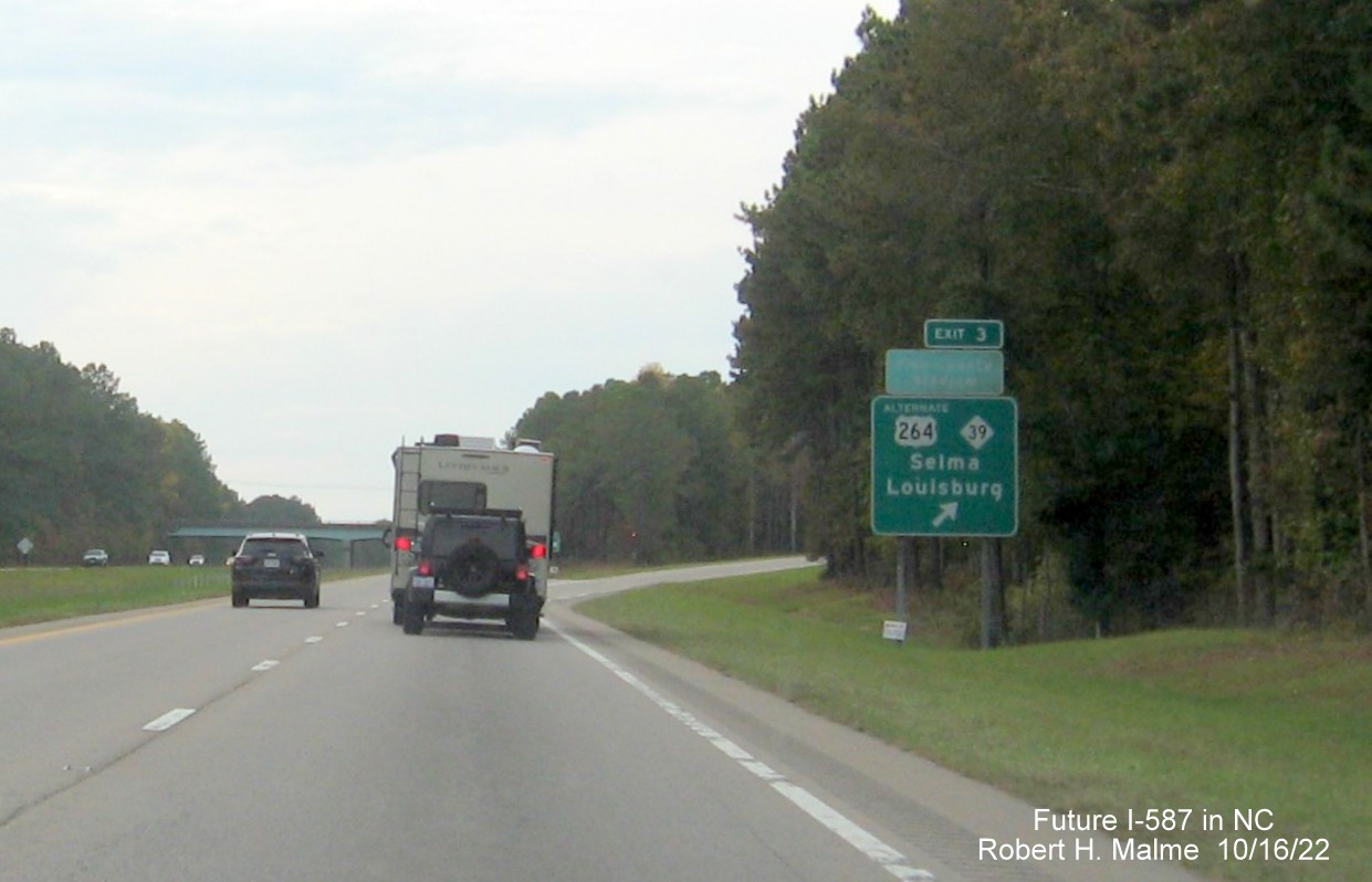 Image of ground mounted ramp sign for US 64 Alt/NC 39 exit on US 264 West with new Future I-587 mileage exit number, October 2022