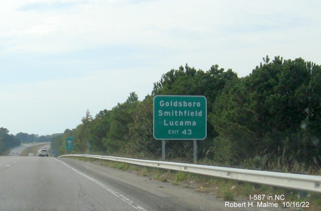 Image of auxilary sign for US 301 to I-795 South exit with old US 264 milepost exit number on I-587/US 264 West in Wilson, October 2022