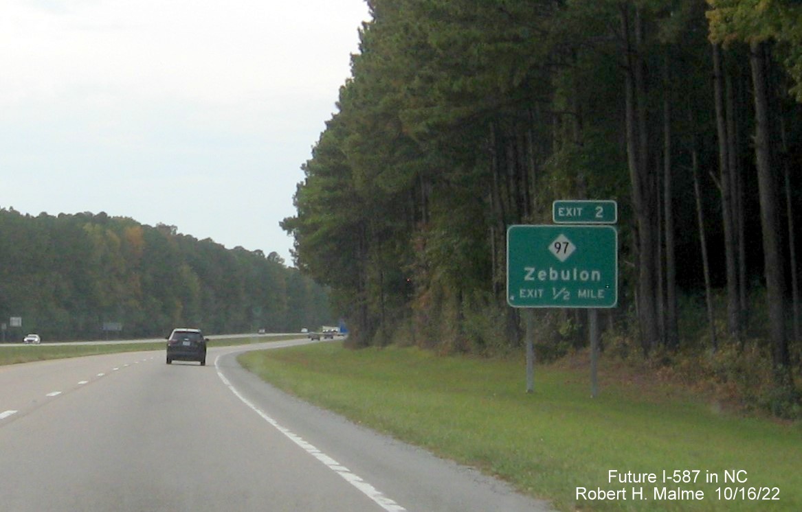 Image of ground mounted 1/2 mile advance sign for NC 97 exit with new Future I-587 mileage exit number, October 2022