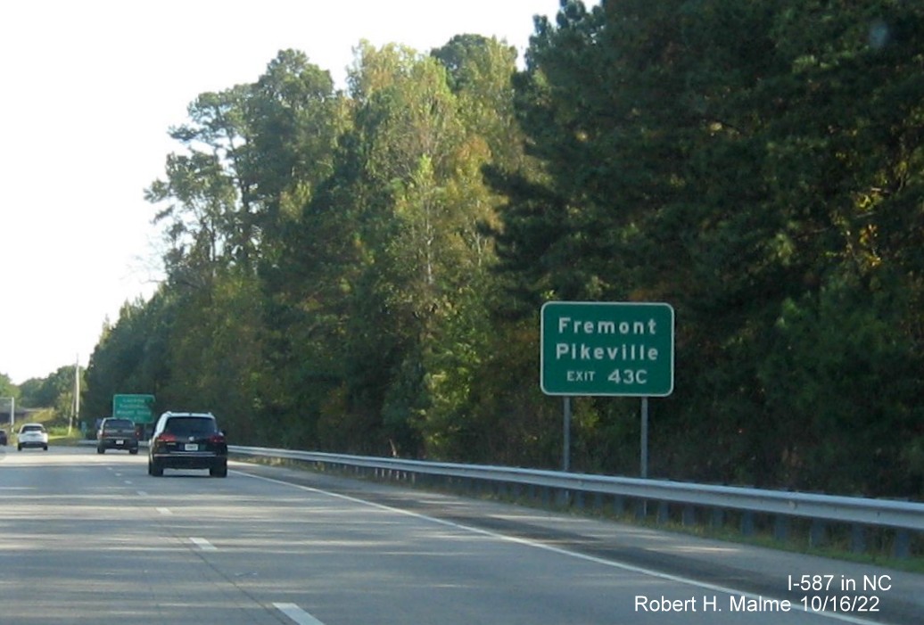 Image of auxilary sign for I-795 South exit still with US 264 milepost exit number on I-587/US 264 East,I-795 
                                        South in Wilson, October 2022