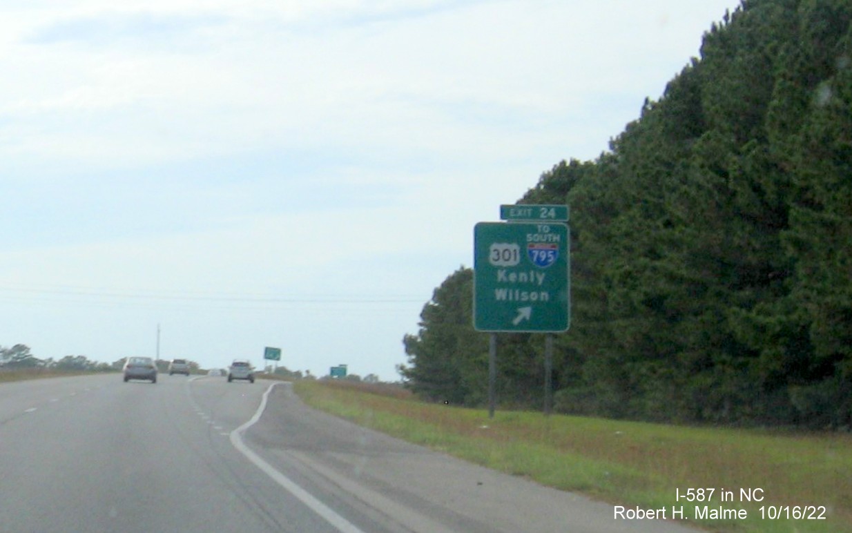 Image of ground mounted ramp sign for US 301 to I-795 South exit with new I-587 milepost exit number on I-587/US 264 West in Wilson, October 2022