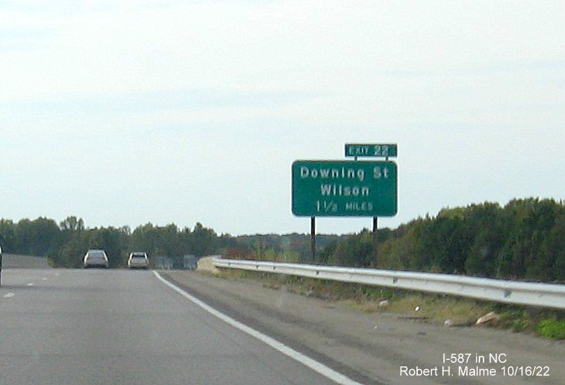 Image of 1 1/4 miles advance sign for Downing Street exit with new I-587 milepost exit number on I-587/US 264 West in Wilson, October 2022