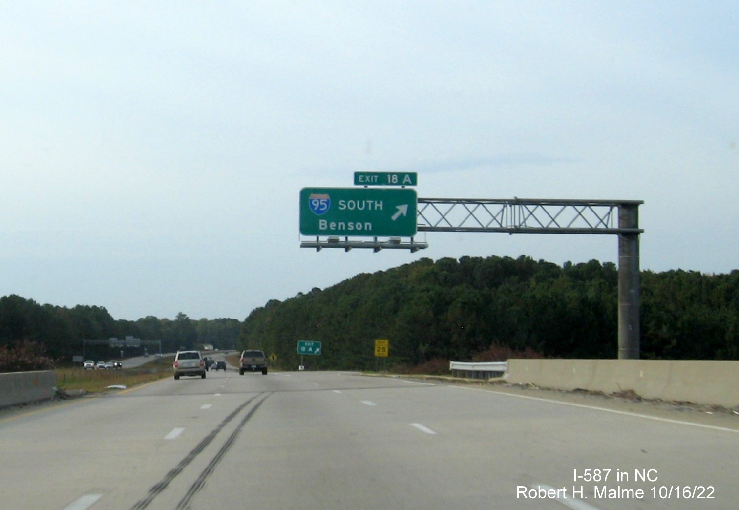 Image of overhead ramp sign for I-95 South exit with new I-587 exit number on I-587 West/I-795 North in Wilson, October 2022